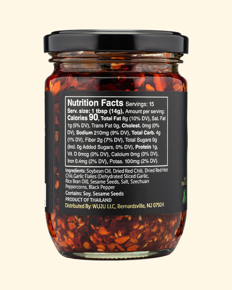 Jar of chili flakes with nutrition facts label on a white background